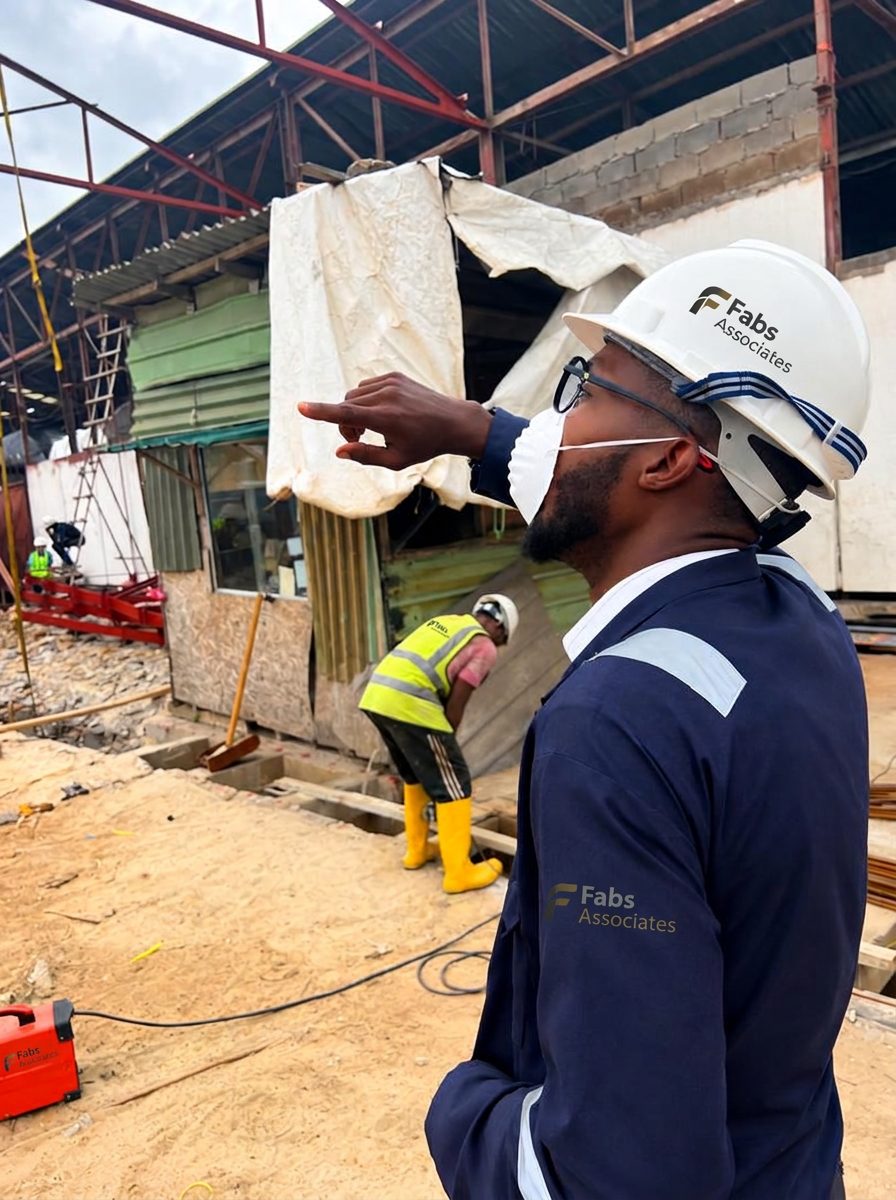 FAB's Associate engineer in hard hat directing works on an active site